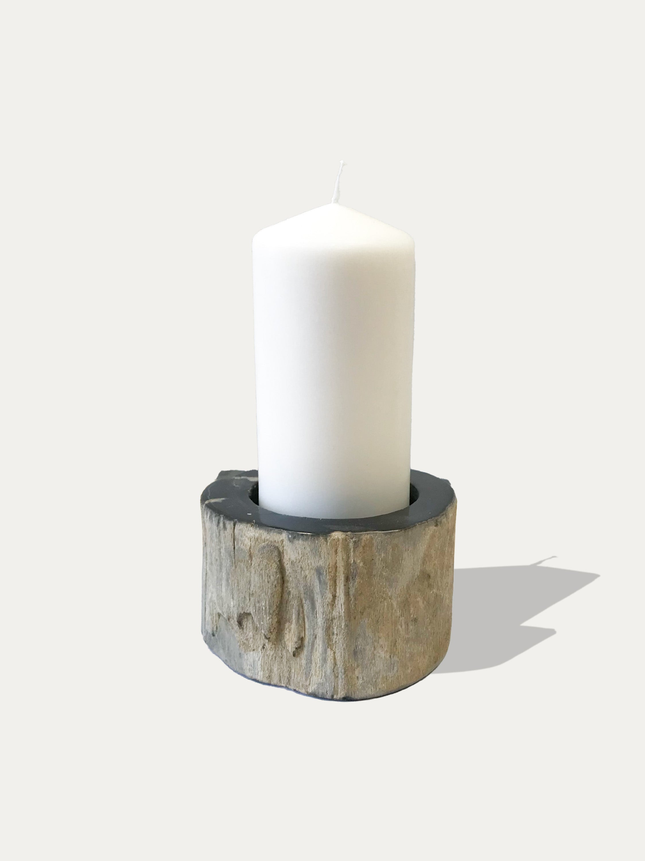 Reversible candle holder in petrified wood