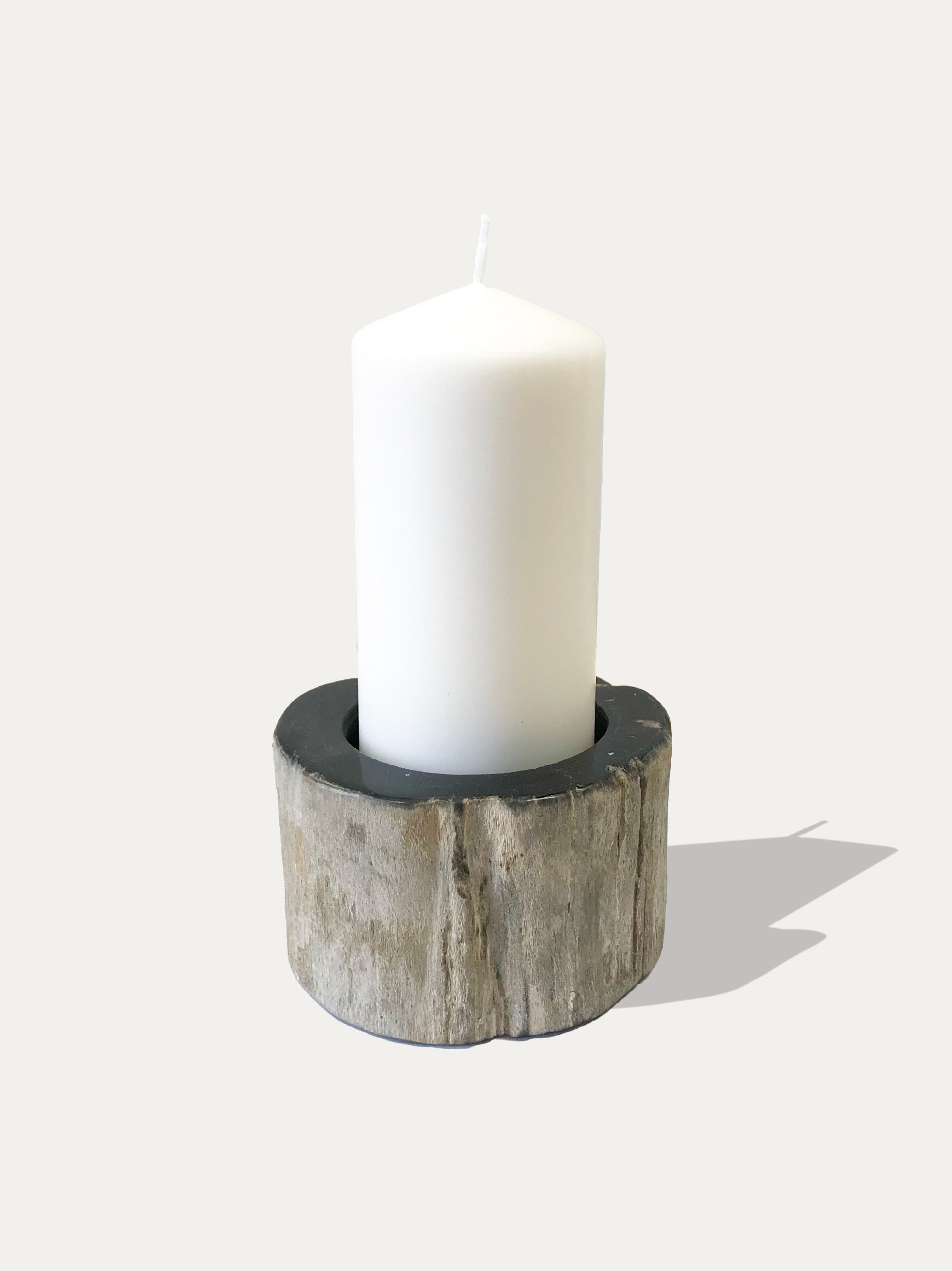 Reversible candle holder in petrified wood
