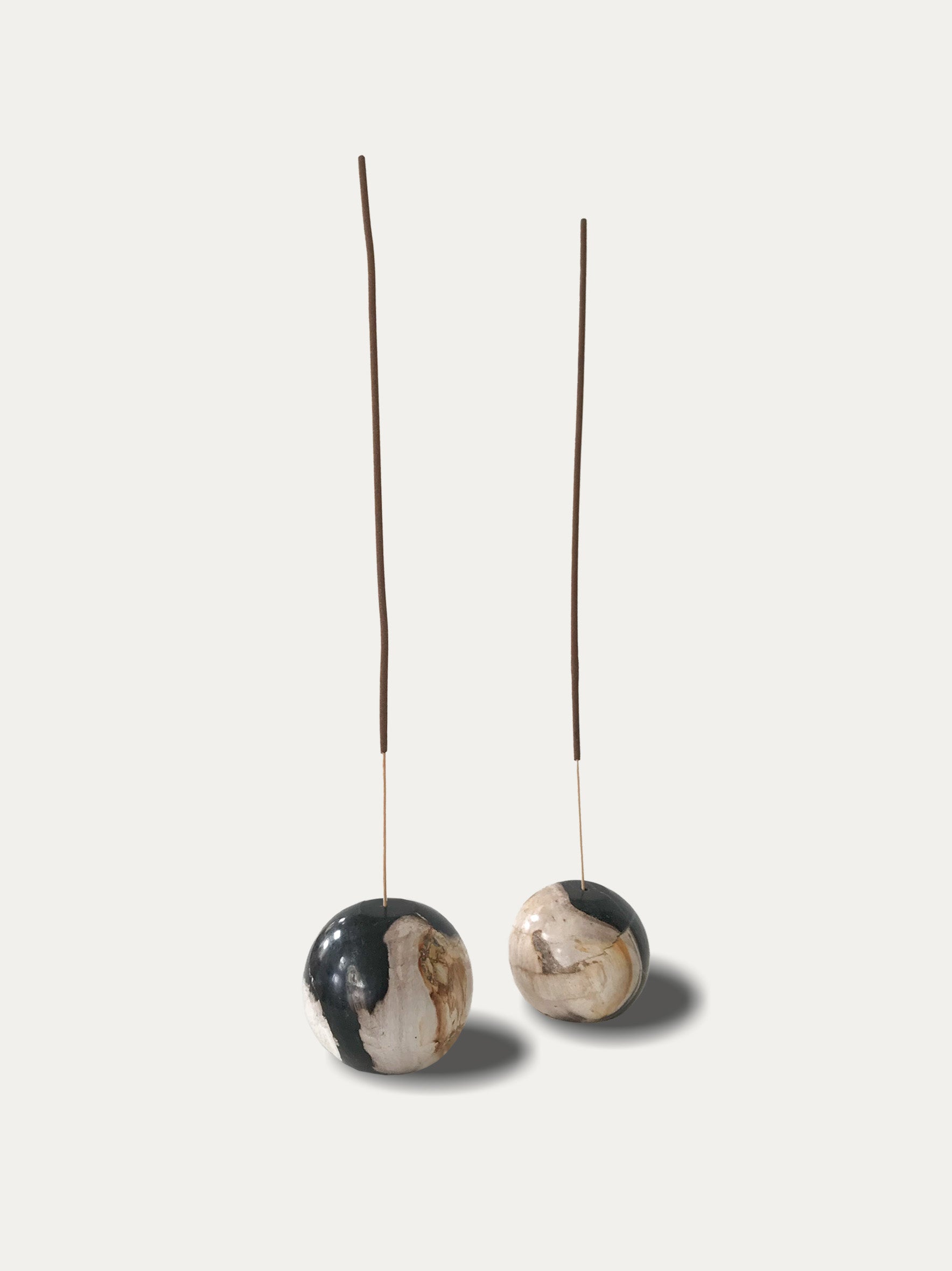 Set of 2 round reversible candle/incense holders in petrified wood and assorted balinese incense