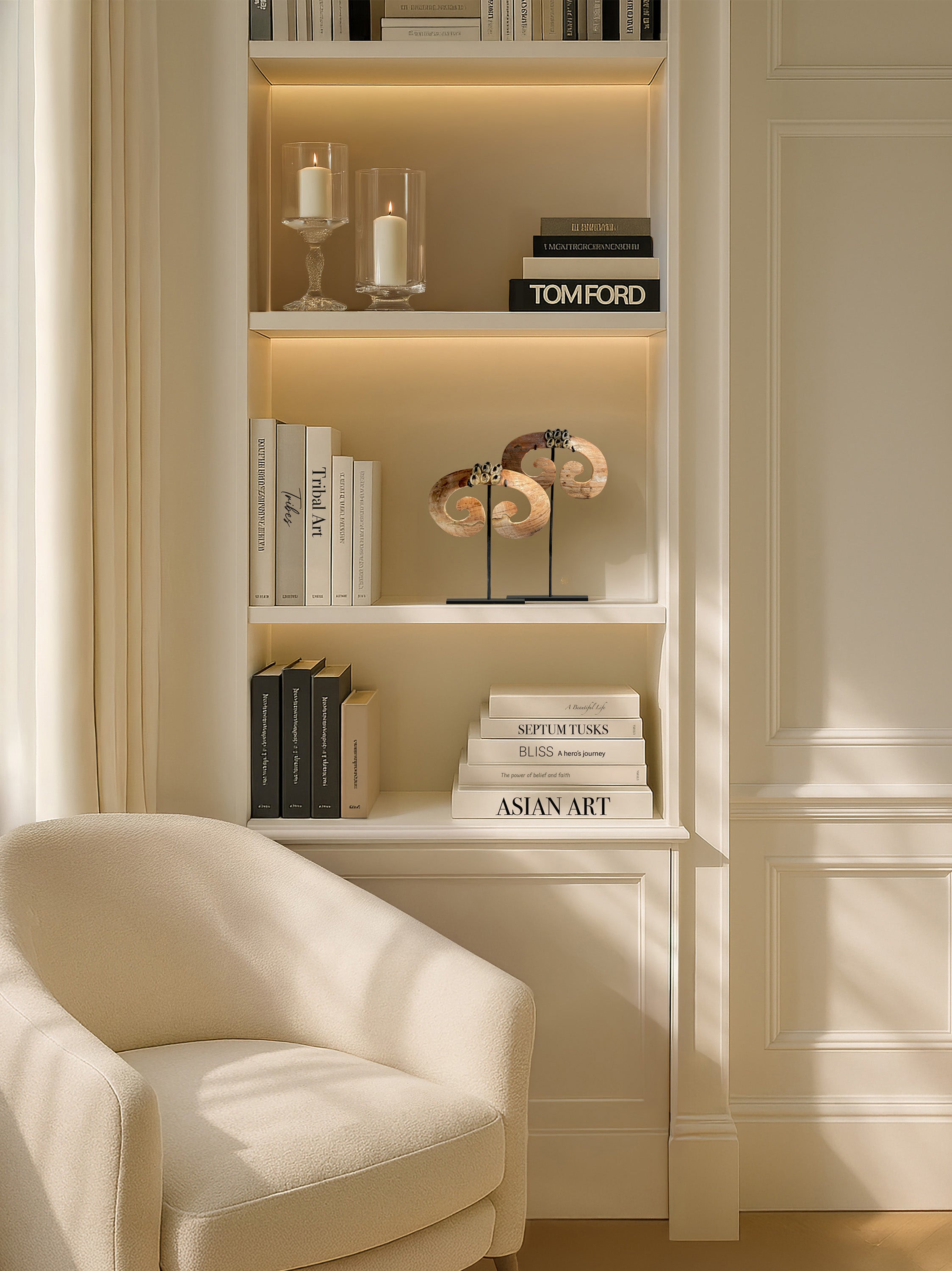 Close-up of hand-carved septum tusks from Papua, captured in soft natural light. A striking tribal accent piece curated by Kirschon, specialists in ethnic art near Lake Como.