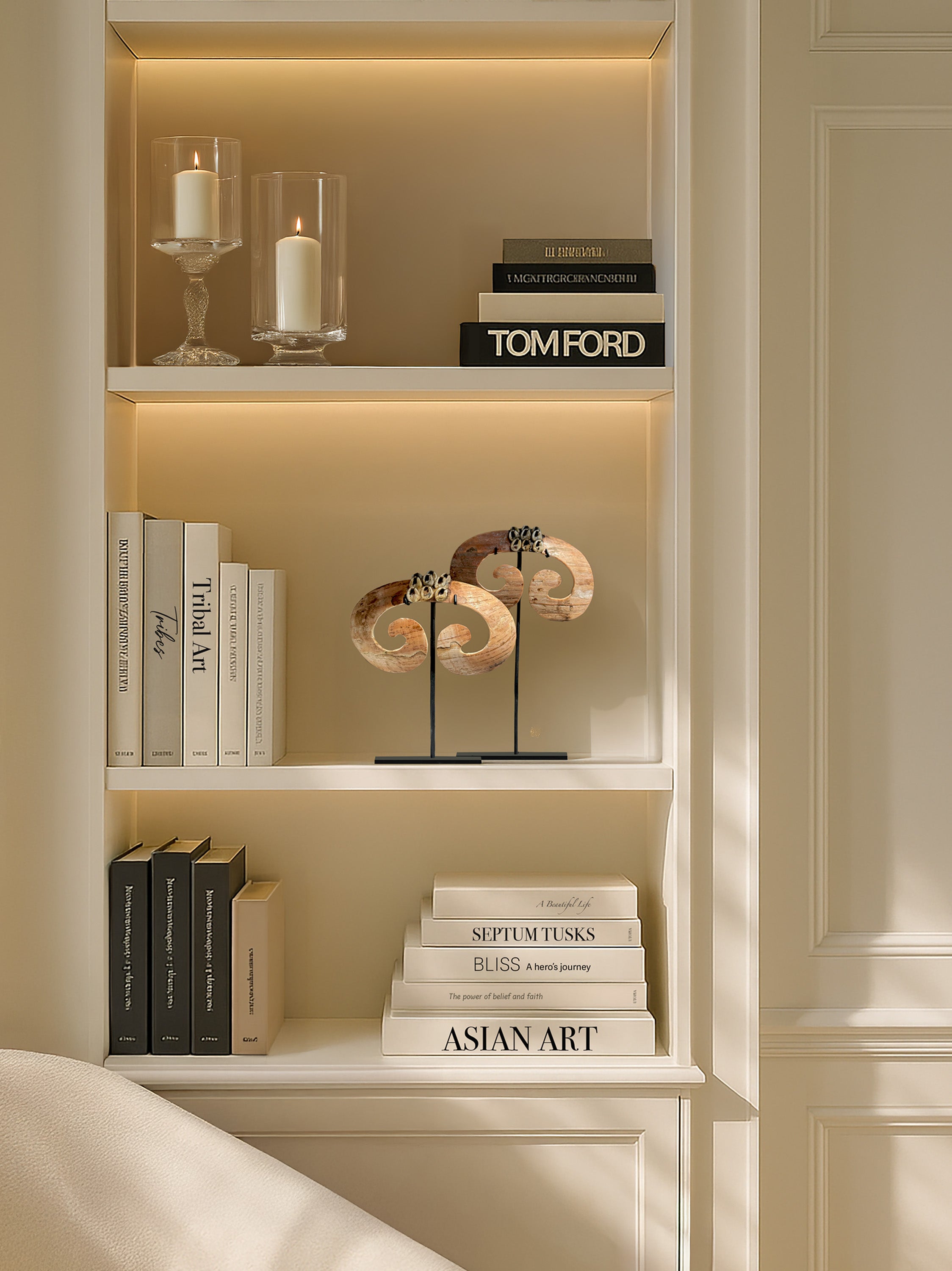 Discover the beauty of tribal heritage with this set of 2 septum tusks from Papua, elegantly displayed in a refined Lake Como interior. A unique accent for luxury homes and collectors of ethnic art.