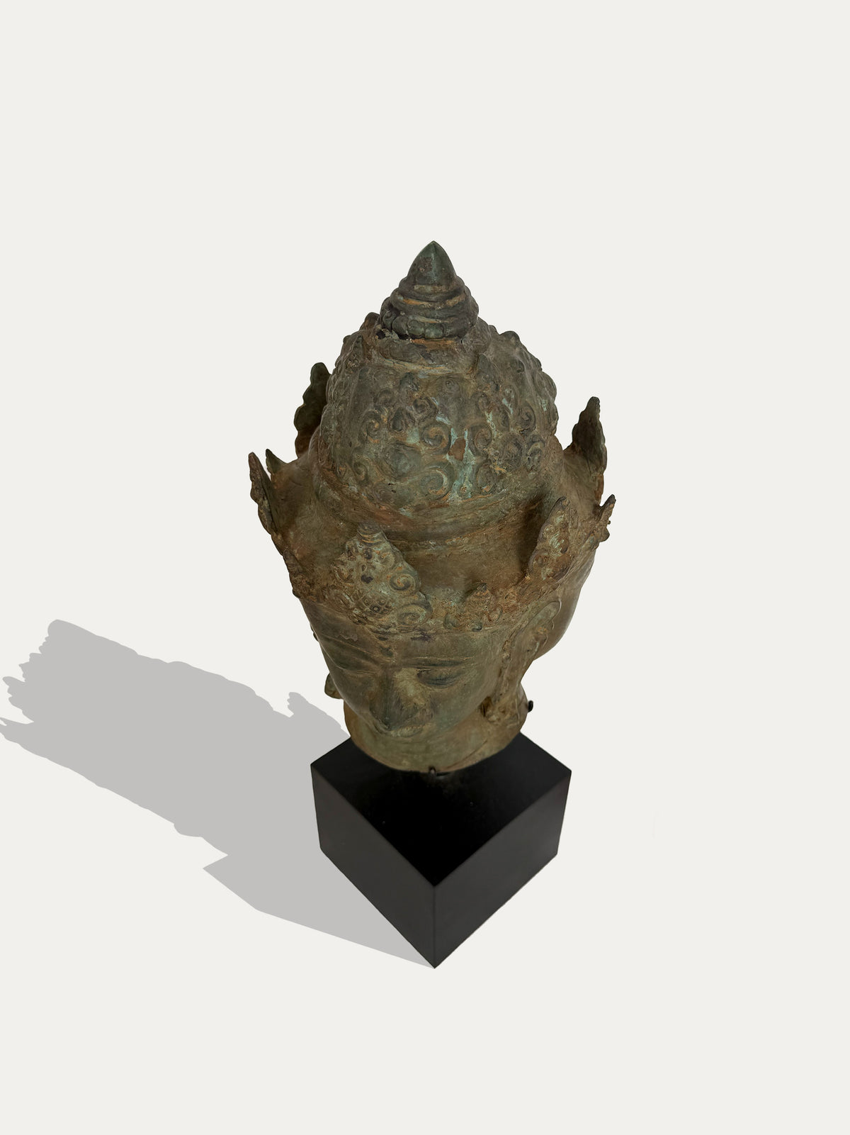 Antique Indonesian bronze multi-faced head inspired by Majapahit art