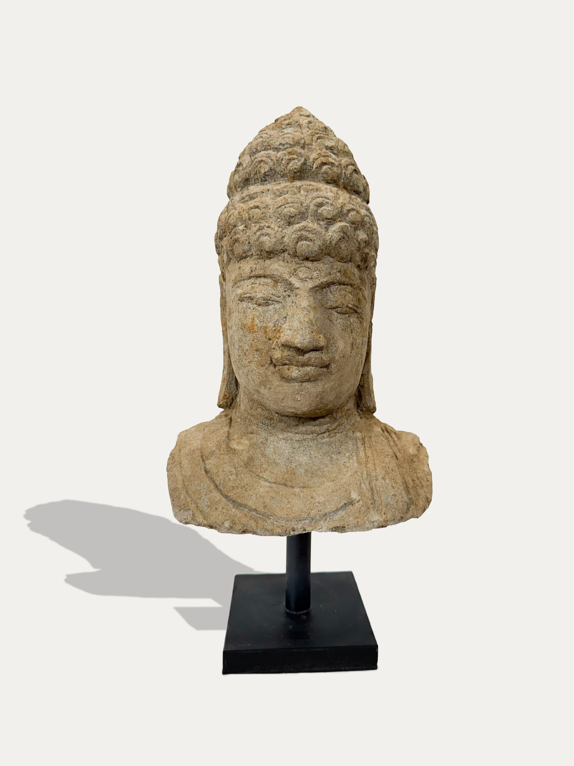 Front view of Java stone Buddha sculpture – handcrafted Asian art available in Italy