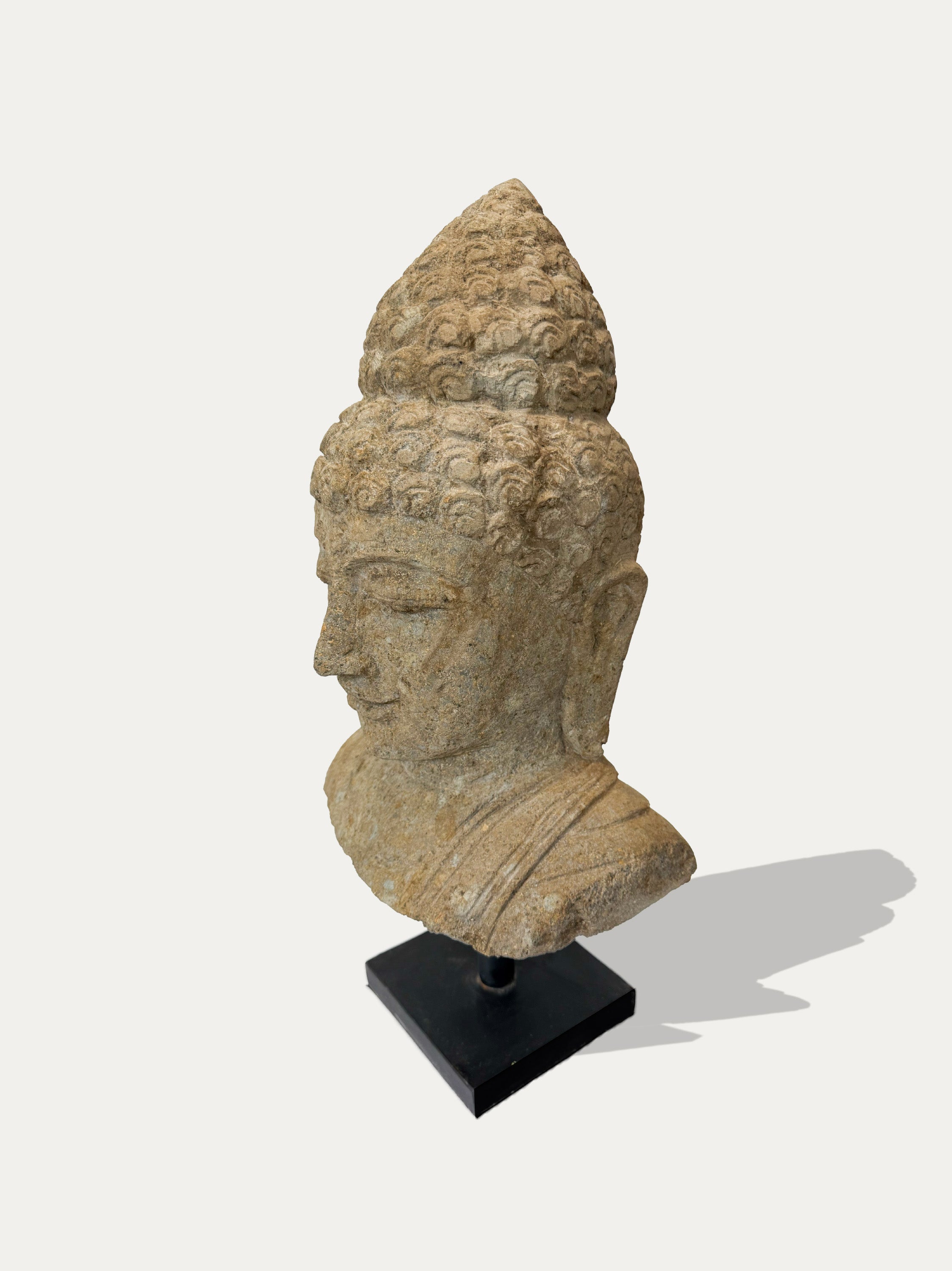 Close-up of hand-sculpted Buddha face – Javanese Asian art from Kirschon Italy