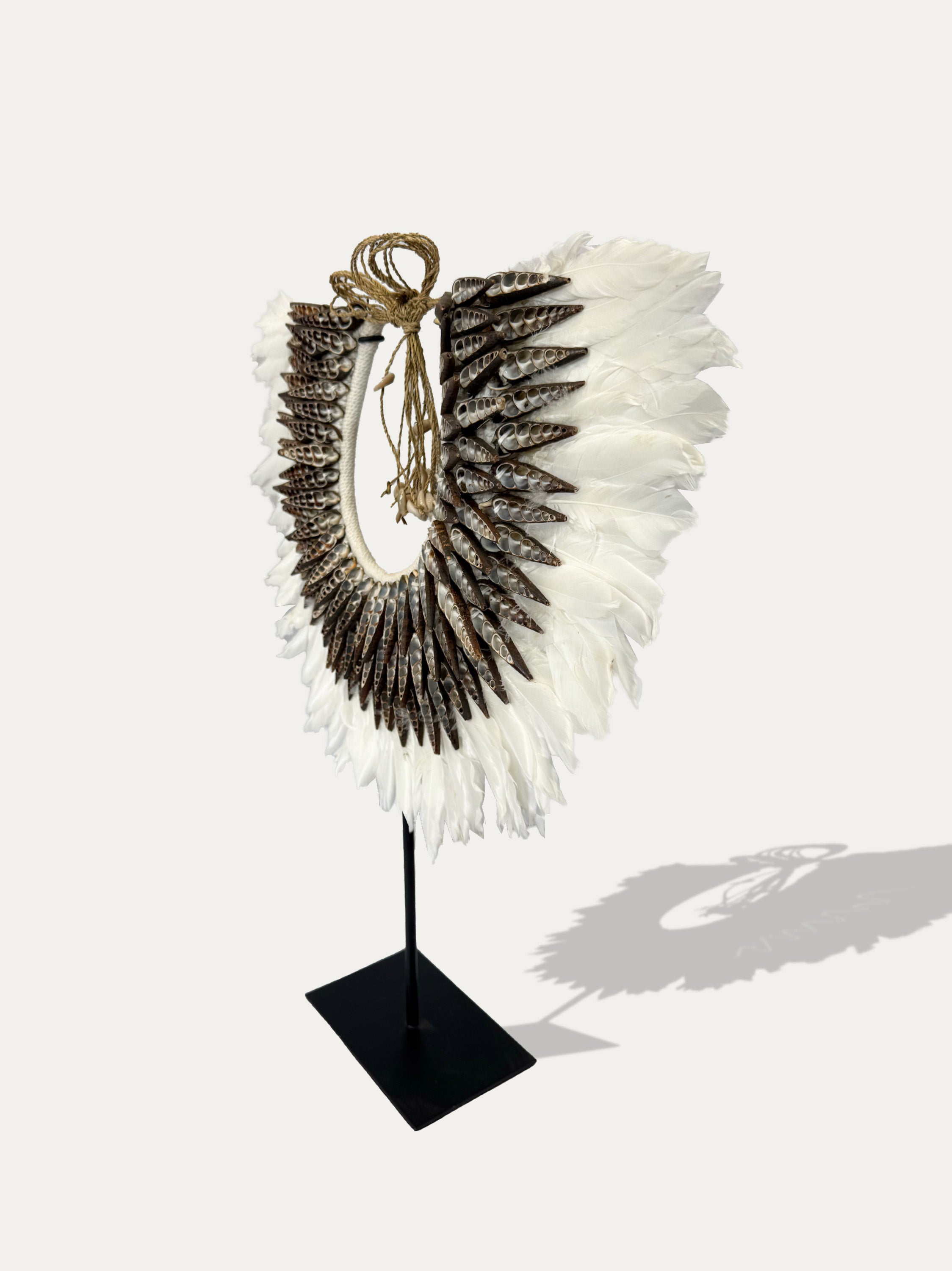 Papua white spiral shell and feather necklace – tribal adornment at Kirschon, Lake Como, Italy.