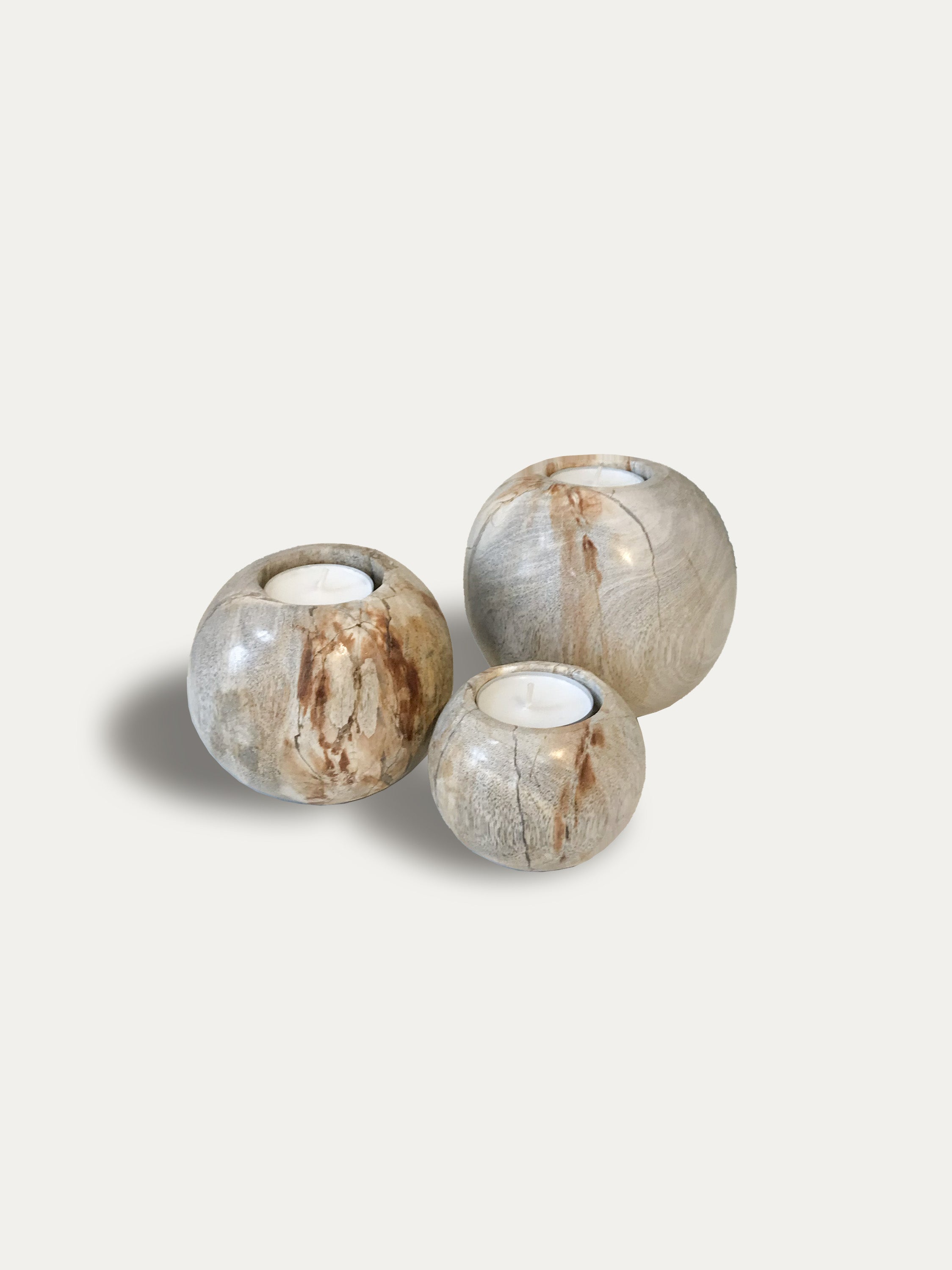 Set of 3 round reversible candle holders in petrified wood
