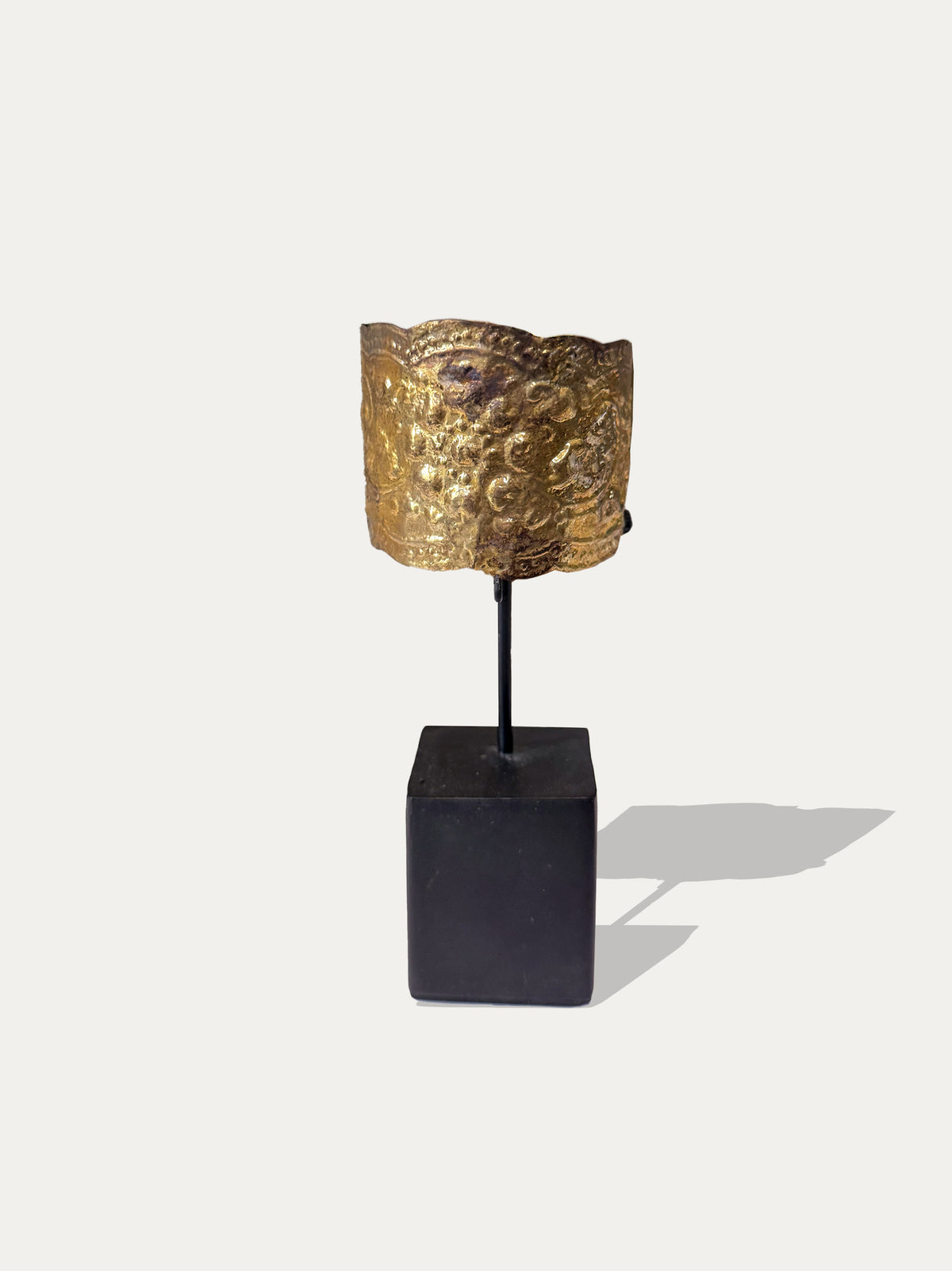 Indonesian brass cuff from Sumatra displayed as tribal decorative art