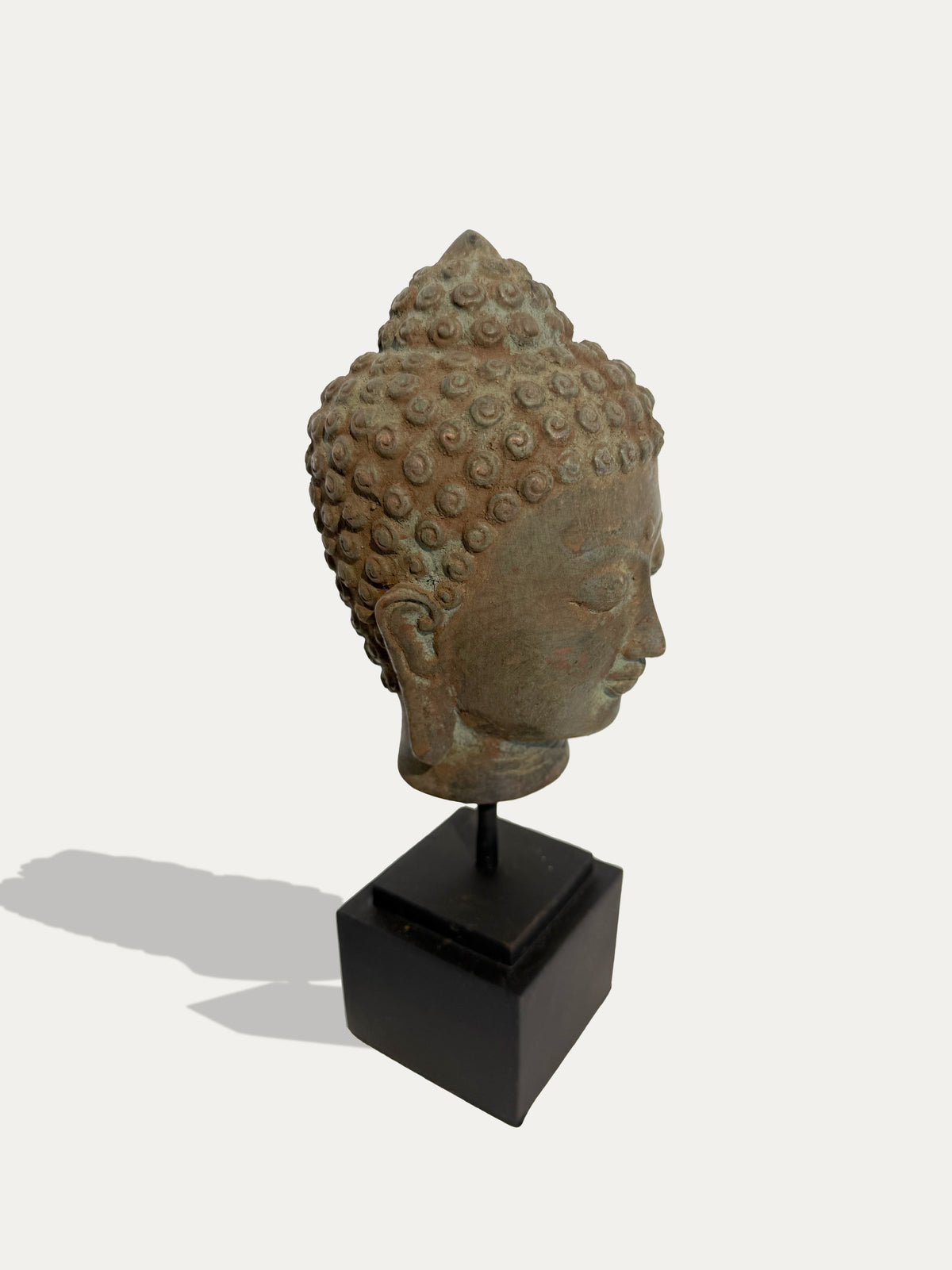 Mid-century Javanese bronze Buddha head sculpture with aged patina