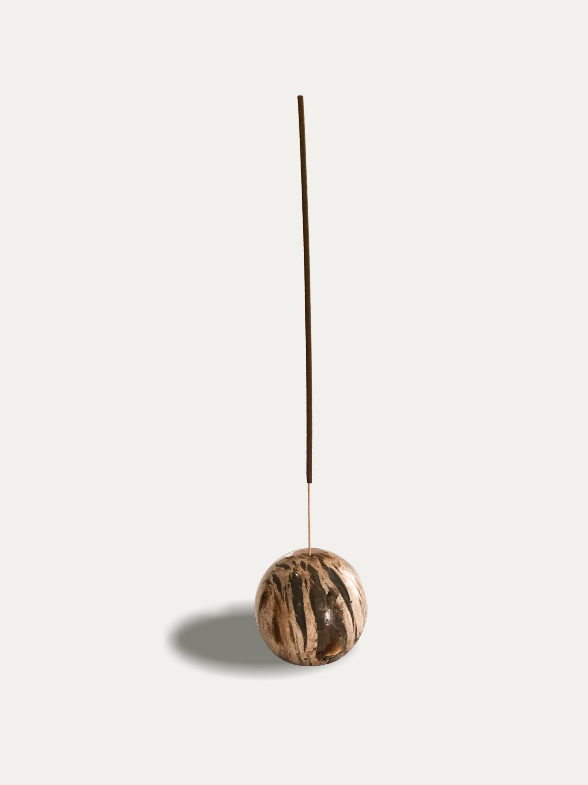 Round reversible candle/incense holder in petrified wood and assorted Balinese incense