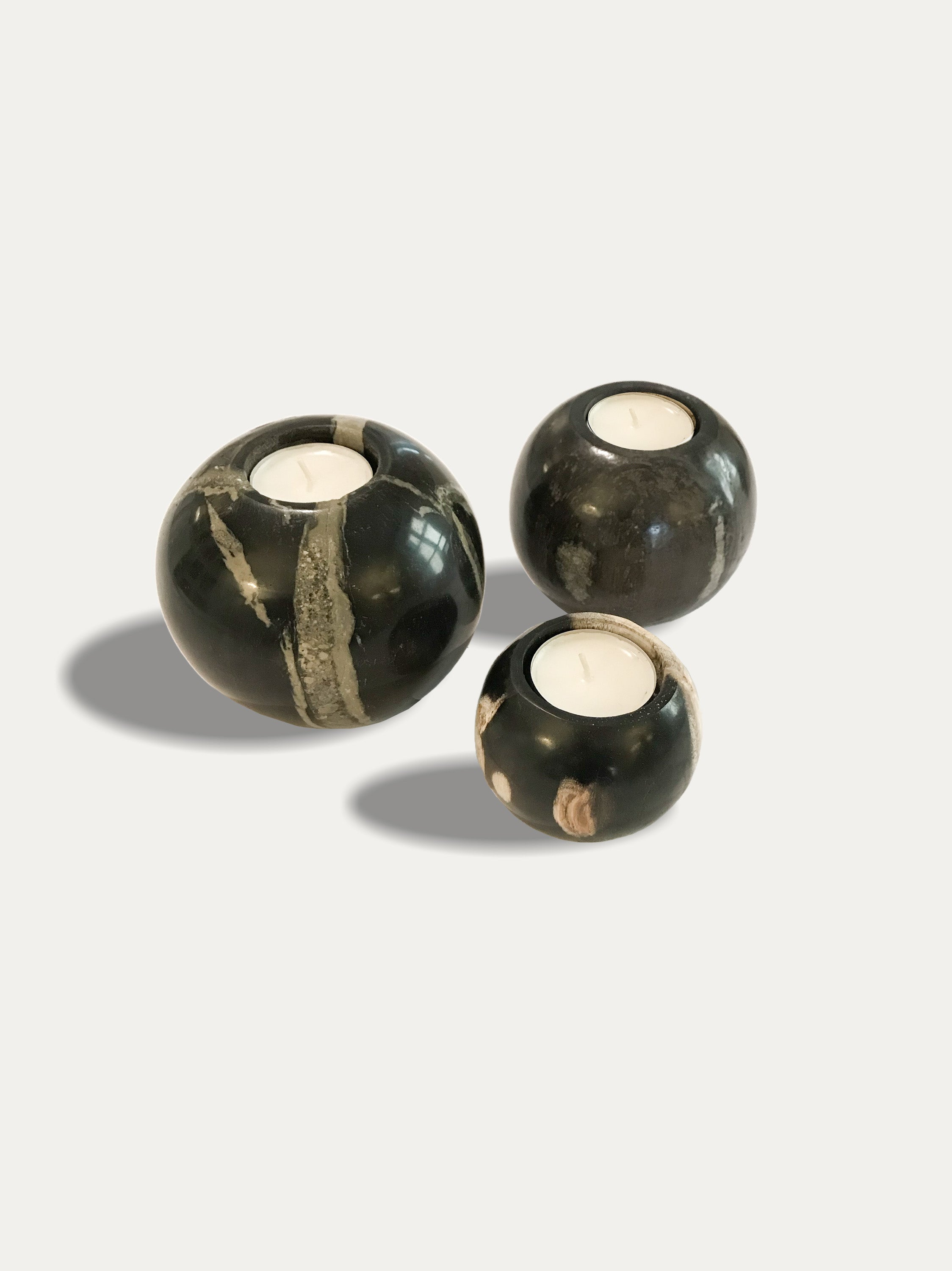 Set of 3 round reversible candle holders in petrified wood