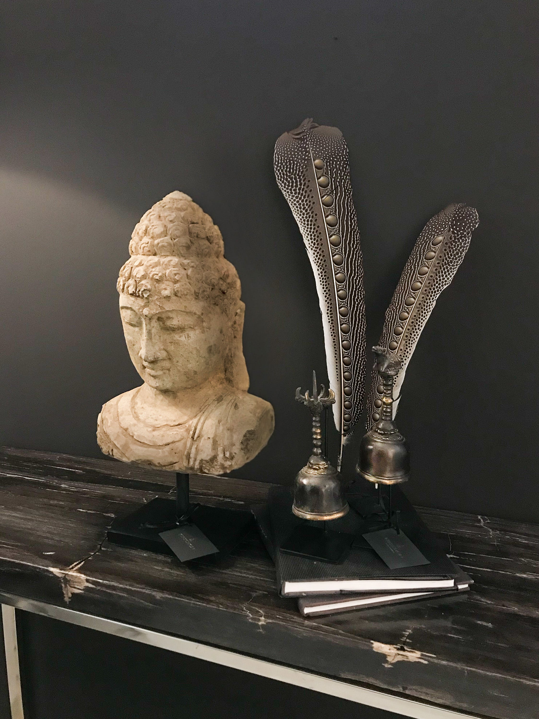 Asian Art from Kirschon, Buddha stone statue, peacock feathers and ghanta temple bells