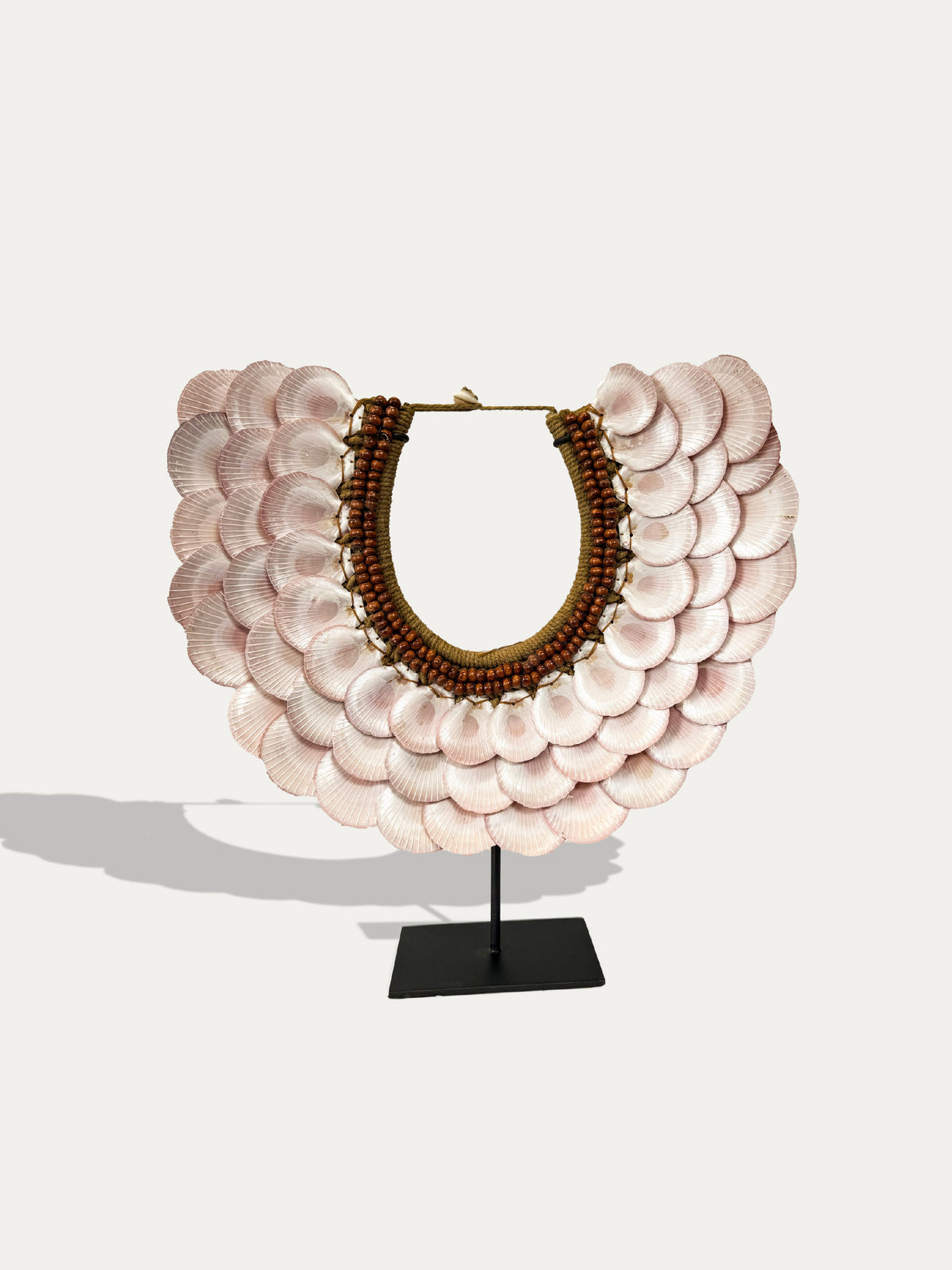 Sumba water bottles and Papua Cardiidae shell necklace styled in a luxury interior