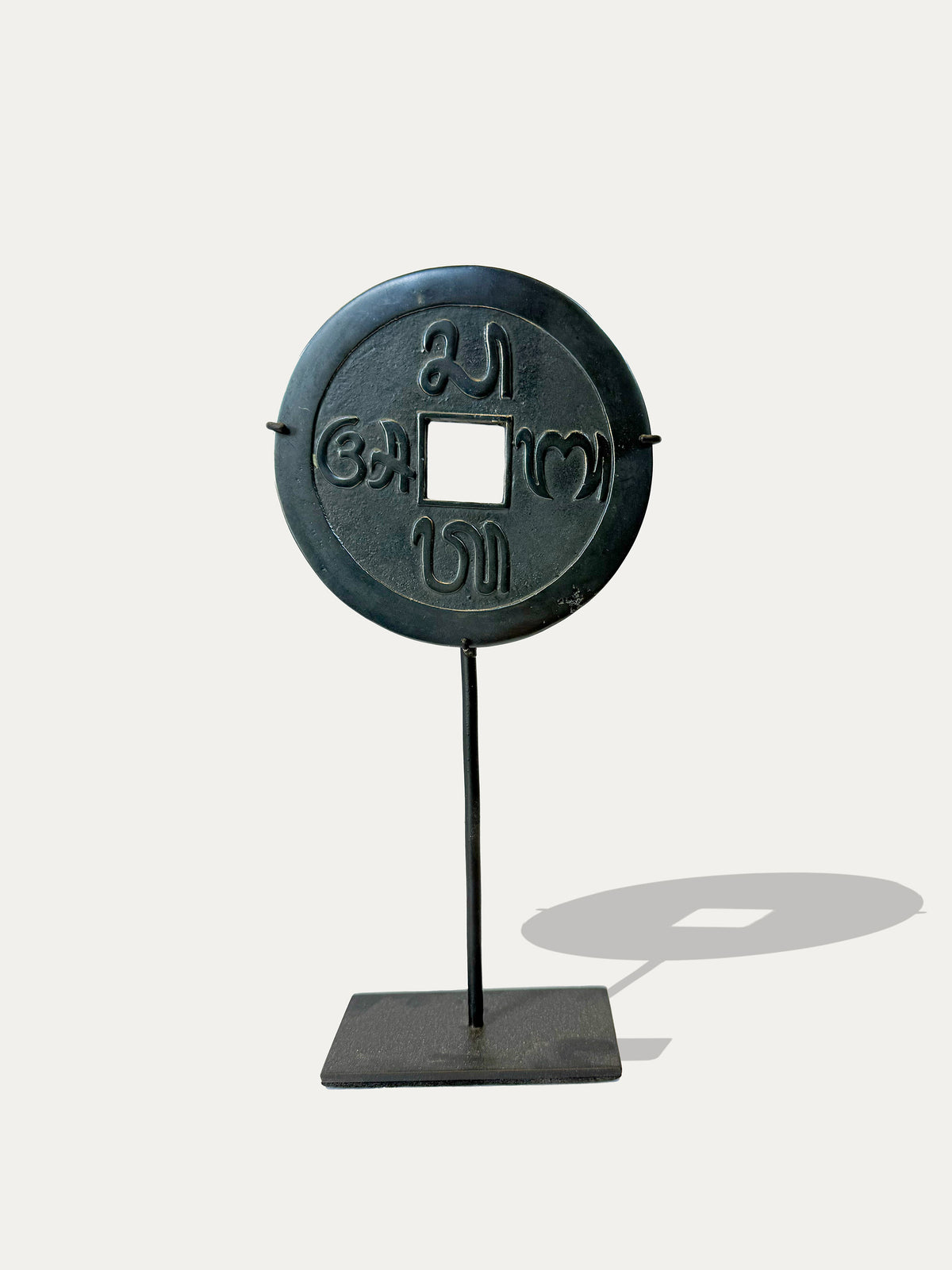 Pair of Pis Bolong coins from Bali with traditional Sa Ba Ta A symbols