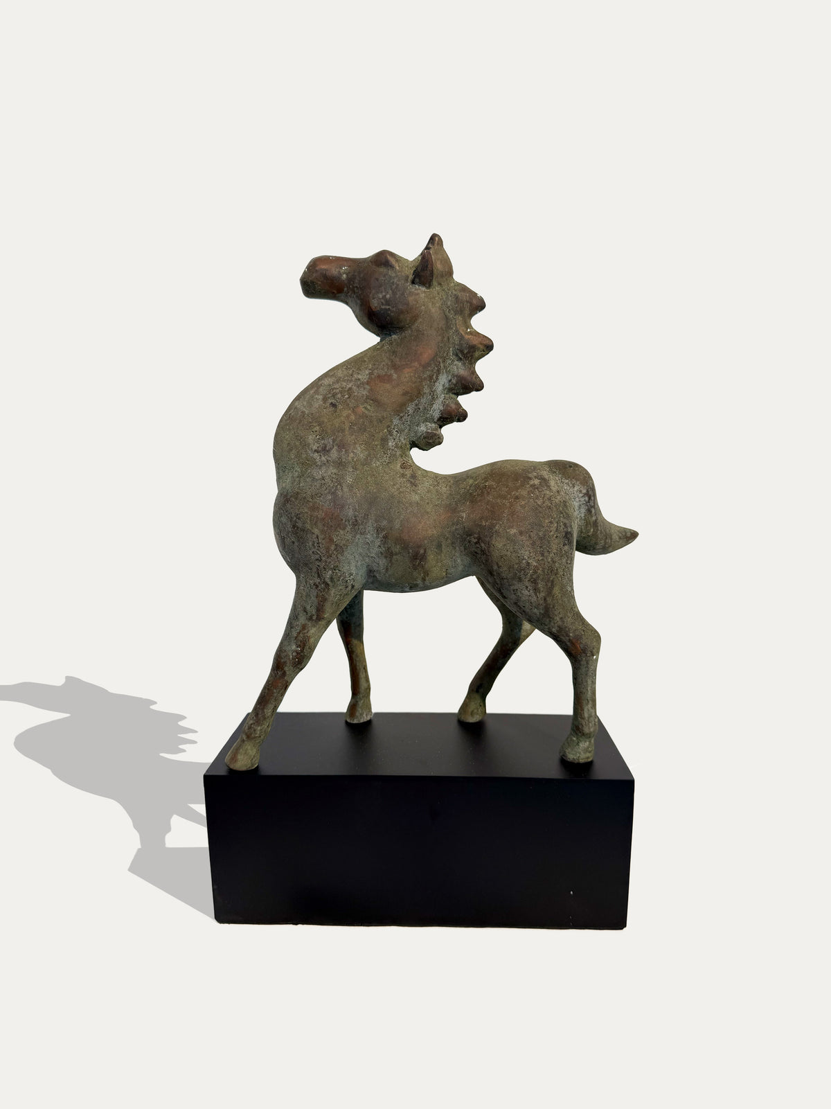 Vintage Chinese cast-metal horse sculpture inspired by traditional equestrian art